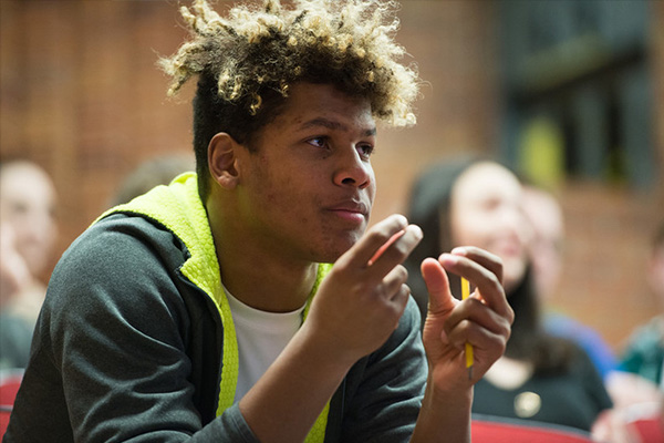 A young man snapping his fingers